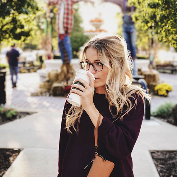 woman drinking coffee at the park